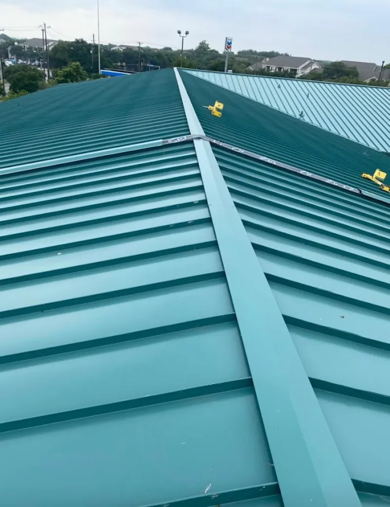 Green commercial metal roof ridge and valley for Metal Roof Repair in Grain Valley